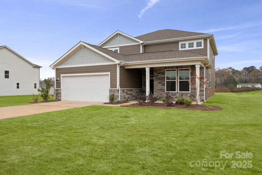 Front exterior of a new home in Running Creek, Locust, NC, highlighting curb appeal (Image 16). Front exterior of a new home in Running Creek, Locust, NC, highlighting curb appeal (Image 16).