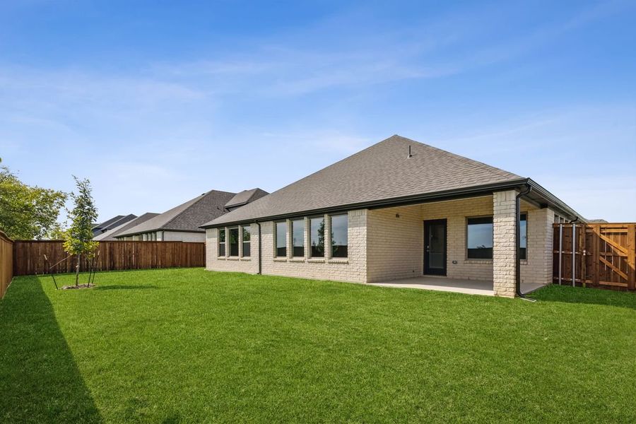 Covered Patio in the Bowie home plan by Trophy Signature Homes – REPRESENTATIVE PHOTO Covered Patio in the Bowie home plan by Trophy Signature Homes – REPRESENTATIVE PHOTO