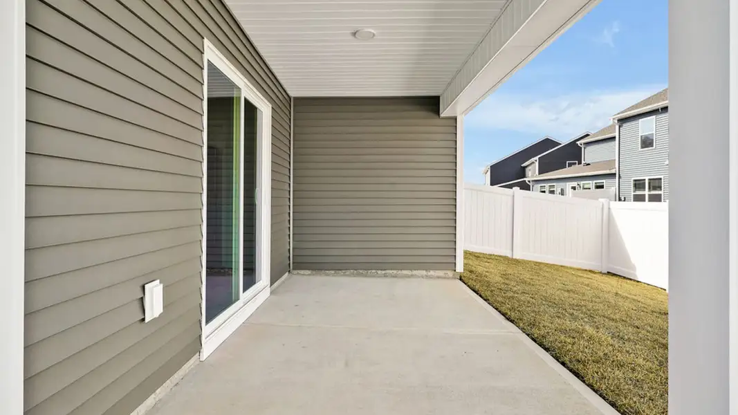 Exterior details and patio area of a home in Indigo Preserve Townhomes, Leland (Image 2).