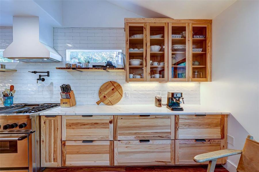 Glass front accent cabinetry with clerestory windows & full-height subway tile backsplash.94 San Saba St., AustinTX 78702 MLS# 7207900