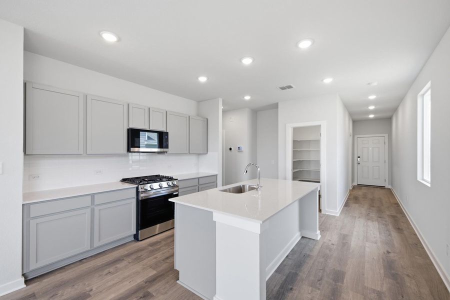 Furnished interior view inside a new home in Stallion Run, Buda (Image 9).