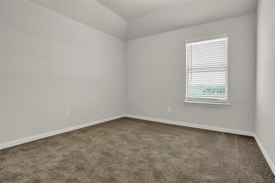 Spare room with dark carpet