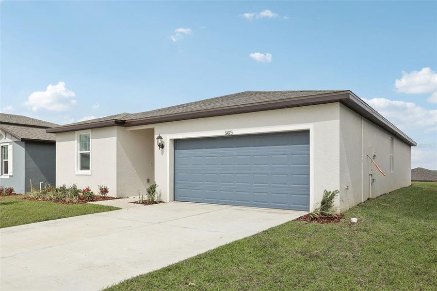 Front exterior of a new home in , Brooksville, FL, highlighting curb appeal (Image 15).