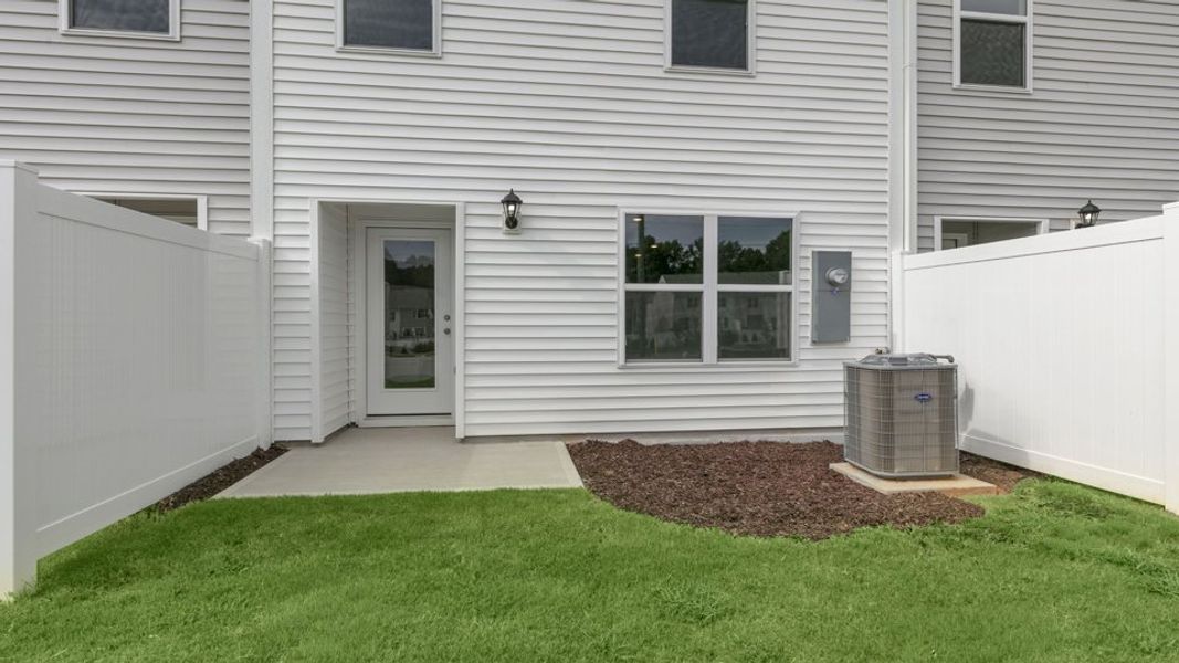 Exterior details and patio area of a home in The Townes at Wilson's Ridge, Smithfield (Image 3).