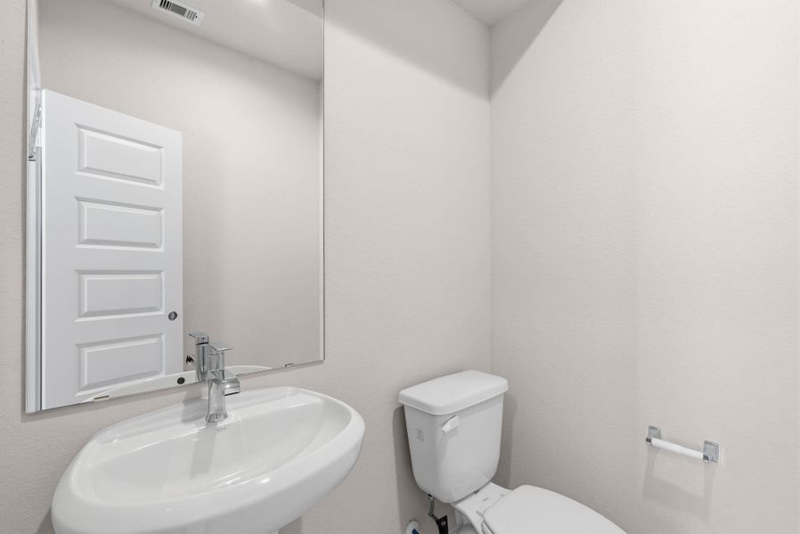 Furnished interior view inside a new home in Barton Creek Ranch, Conroe (Image 7).