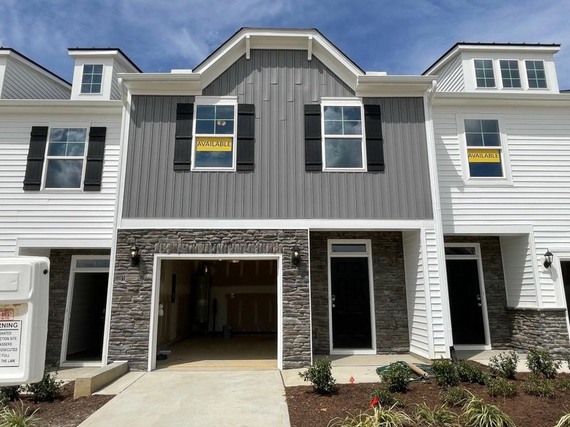 Front exterior of a new home in 1158 Place Townhomes, Wilson, NC, highlighting curb appeal (Image 1).