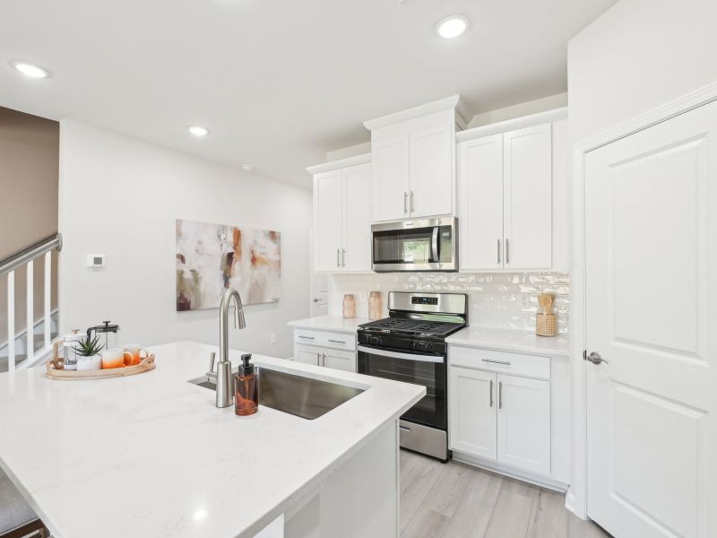 Kitchen in the Topaz floorplan at a Meritage Homes community in Mebane, NC.