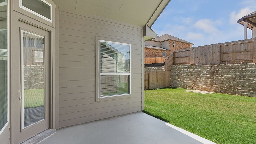 Representative exterior details of a home built from the Brenner by Chesmar Homes in Newhaven, Manor (Image 4).