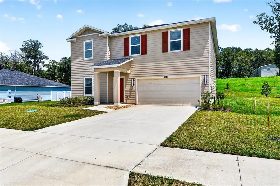 Front exterior of a new home in Tara Forest East, Alachua, FL, highlighting curb appeal (Image 2).