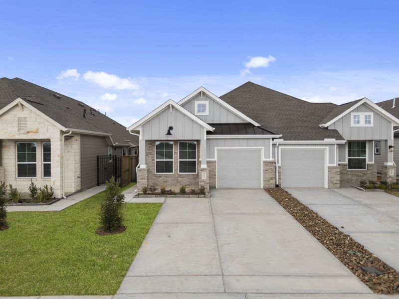 Front exterior of a new home in Meridiana, Manvel, TX, highlighting curb appeal (Image 20).