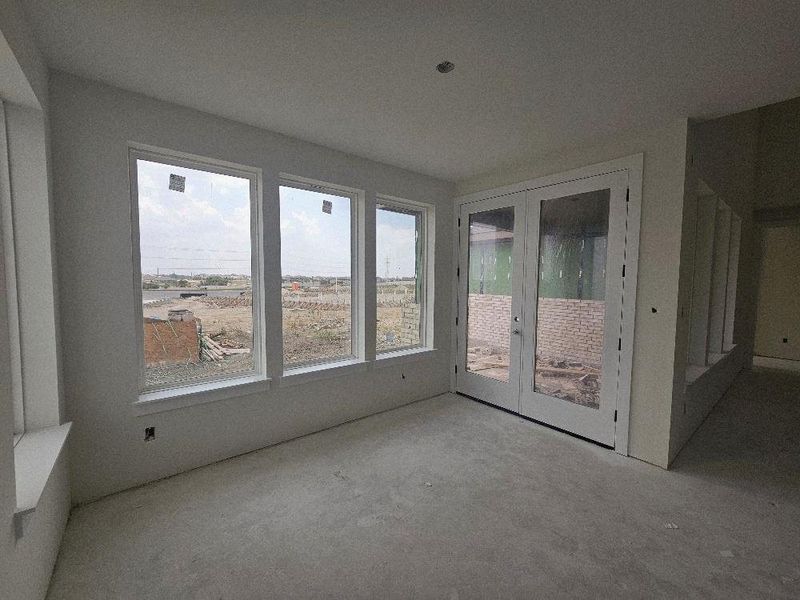 Unfurnished sunroom with french doors Unfurnished sunroom with french doors