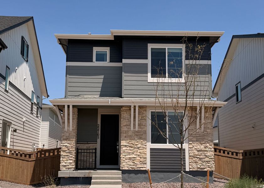 Front exterior of a new home in Windler, Aurora, CO, highlighting curb appeal (Image 1). Front exterior of a new home in Windler, Aurora, CO, highlighting curb appeal (Image 1).
