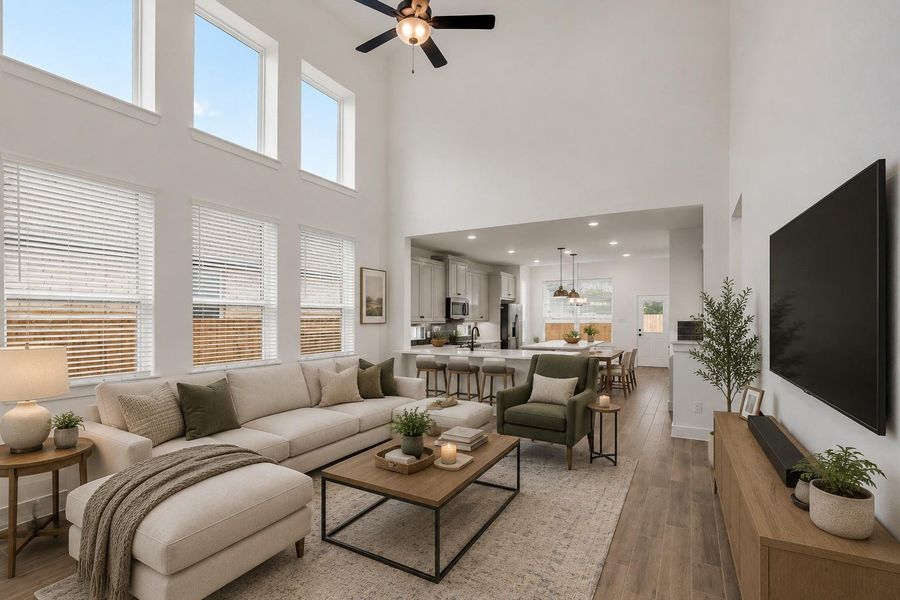 Oversized Windows greet you upon entry to the Living space open to the Kitchen and Dining.Spacious and Open floor plan, Family Room, Kitchen and Dining. Virtually staged Photo