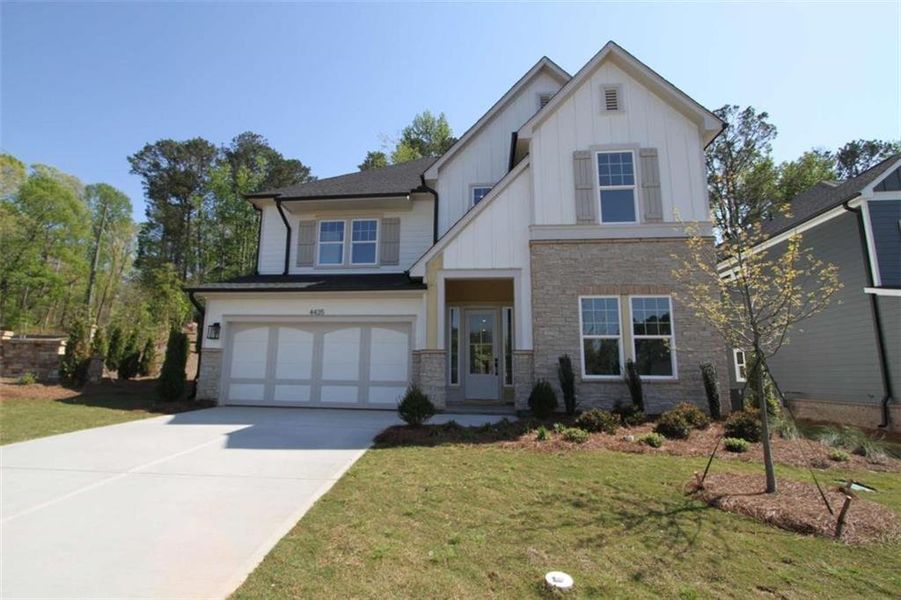 Front exterior of a new home in Settingdown Farms, Cumming, GA, highlighting curb appeal (Image 19).