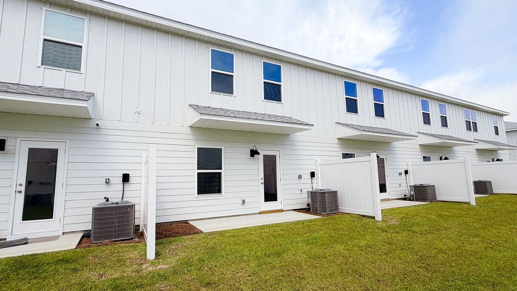 Exterior details and patio area of a home in Salt Creek Townhomes at Mexico Beach, Mexico Beach (Image 3).