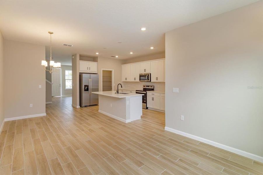 Furnished interior view inside a new home in Serenade at Ovation, Winter Garden (Image 17).