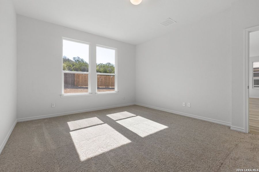 Spacious, unfurnished interior of a new home in Hidden Bluffs at TRP, San Antonio (Image 26).