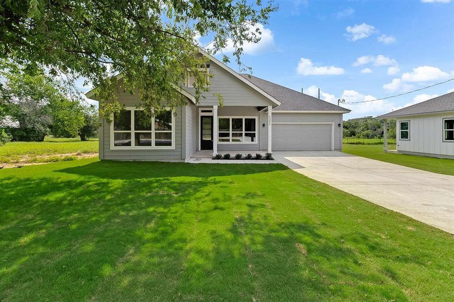 Front exterior of a new home in , Marble Falls, TX, highlighting curb appeal (Image 15).