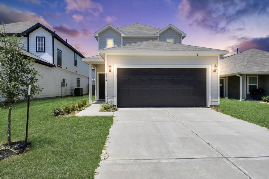 Front exterior of a new home in Townsend Reserve, Splendora, TX, highlighting curb appeal (Image 2). Front exterior of a new home in Townsend Reserve, Splendora, TX, highlighting curb appeal (Image 2).