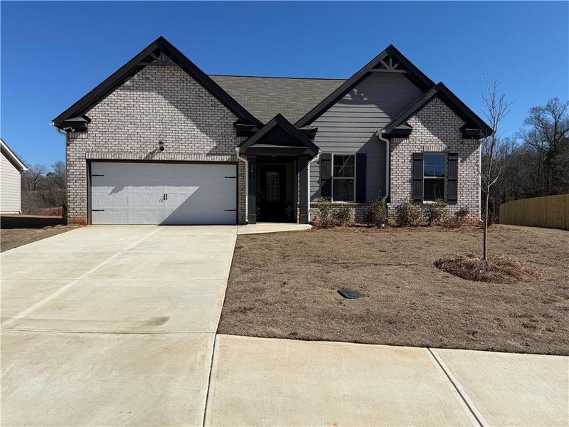 Front exterior of a new home in Hellen Valley, Braselton, GA, highlighting curb appeal (Image 1). Front exterior of a new home in Hellen Valley, Braselton, GA, highlighting curb appeal (Image 1).