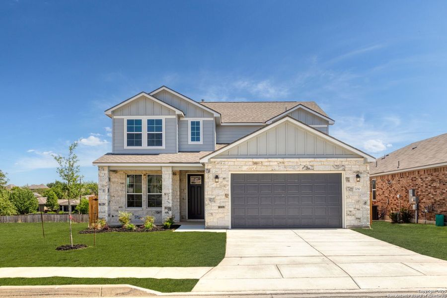 Front exterior of a new home in Skybrooke, Live Oak, TX, highlighting curb appeal (Image 2).
