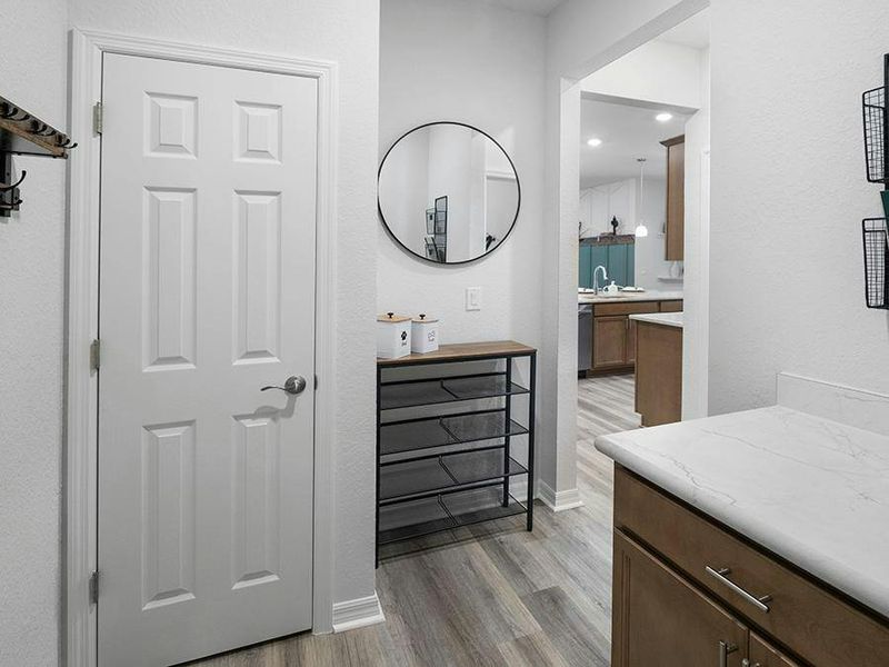 A mud room with a closet at the garage entry provides space for jackets, shoes, and more - Summerlyn II by Highland Homes