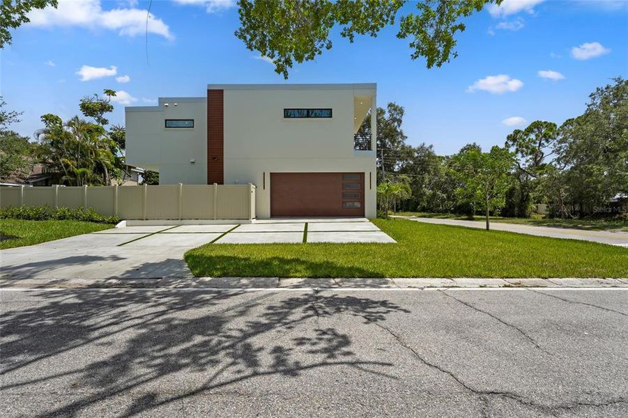 Front exterior of a new home in , Sarasota, FL, highlighting curb appeal (Image 32).