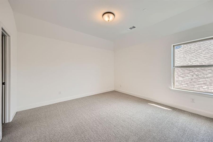 Spare room with carpet floors