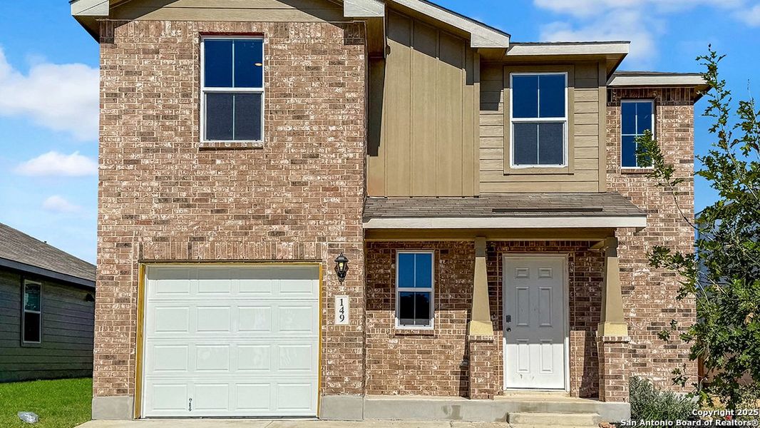 Front exterior of a new home in Redbird Ranch, San Antonio, TX, highlighting curb appeal (Image 2). Front exterior of a new home in Redbird Ranch, San Antonio, TX, highlighting curb appeal (Image 2).