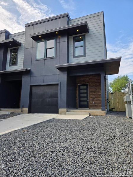 Front exterior of a new home in , San Antonio, TX, highlighting curb appeal (Image 1).