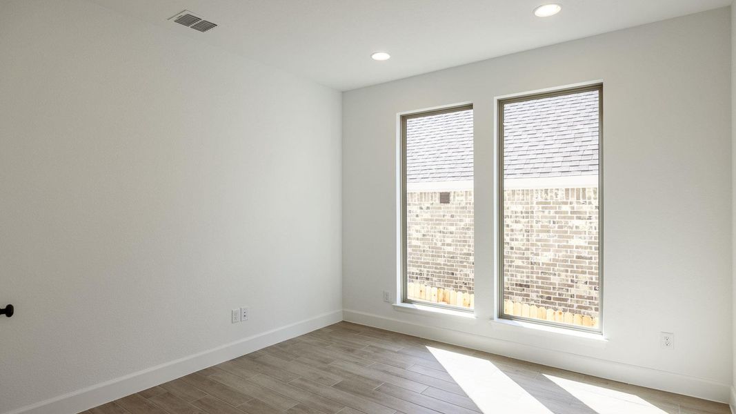 Empty room with light wood-style flooring and recessed lighting Empty room with light wood-style flooring and recessed lighting