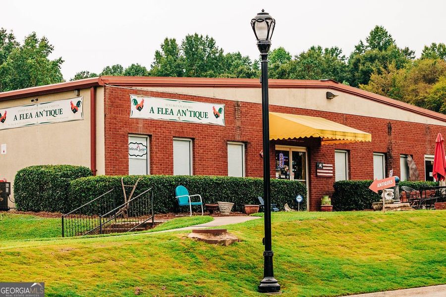 Front exterior of a new home in Rosewood Lake Estates, Hoschton, GA, highlighting curb appeal (Image 30).