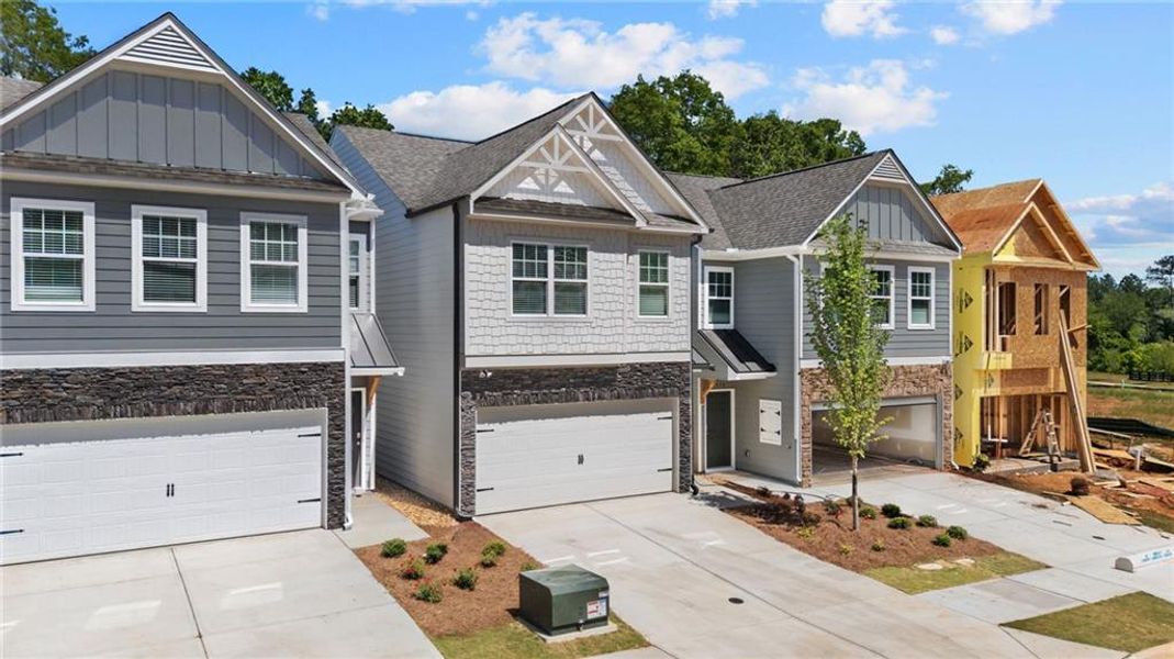 Front exterior of a new home in Owen Preserve, Canton, GA, highlighting curb appeal (Image 2).