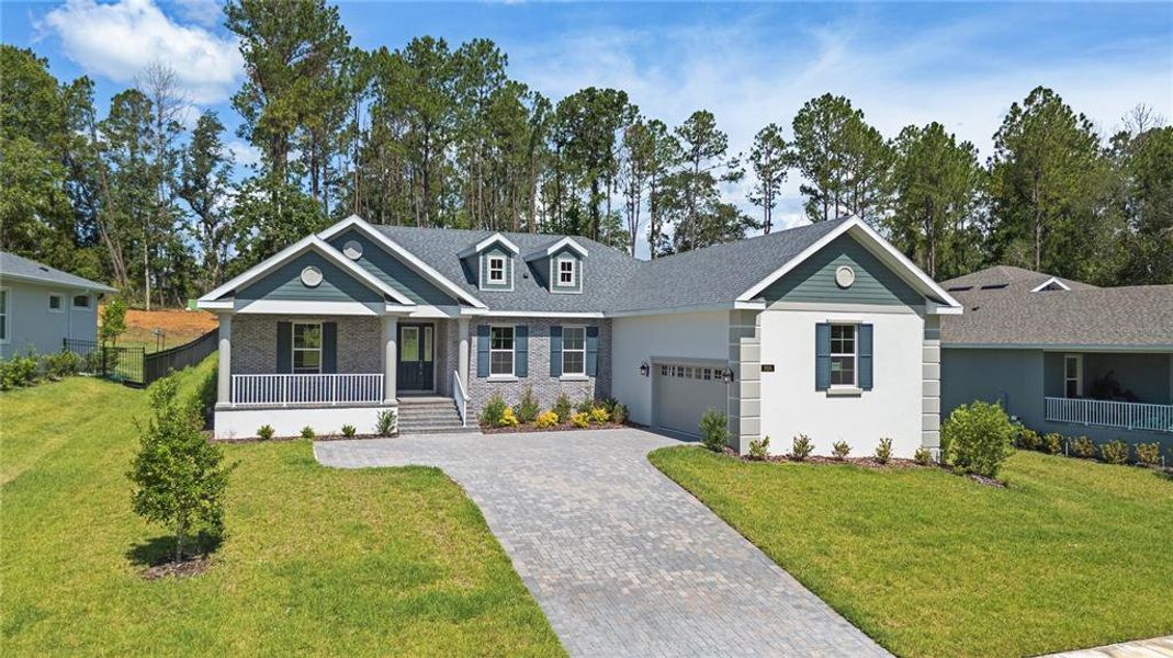 Front exterior of a new home in Southern Hills Plantation, Brooksville, FL, highlighting curb appeal (Image 1). Front exterior of a new home in Southern Hills Plantation, Brooksville, FL, highlighting curb appeal (Image 1).