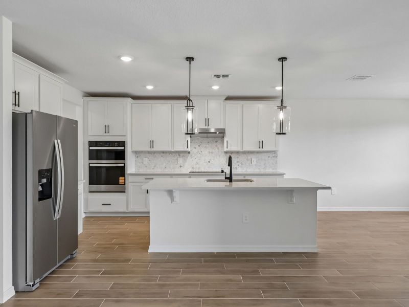Furnished interior view inside a new home in The Grove at Stuart Crossing - Signature Series, Bartow (Image 3).