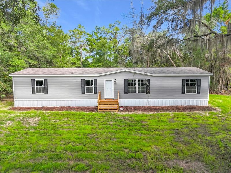 Exterior details and patio area of a home in , Satsuma (Image 25).