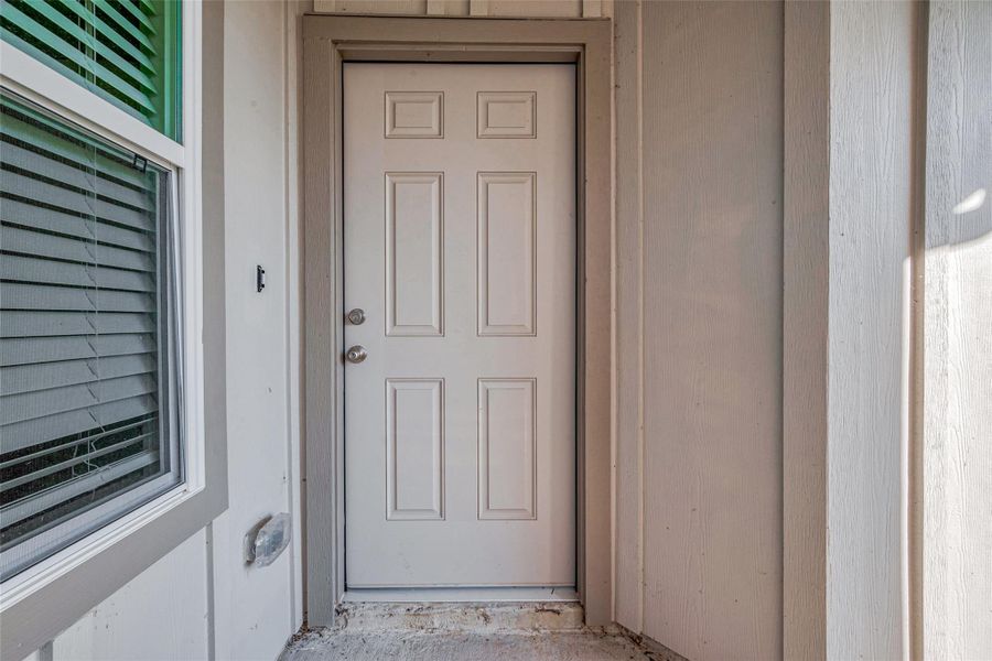 Exterior details and patio area of a home in Woodland Lakes, Huffman (Image 21).