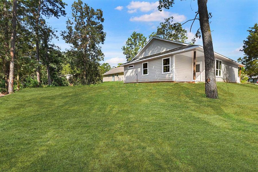 Massive back yard-again sod has just been edited in for the pictures.  It will be put in even with the home.  Home has also now been pressure washed.