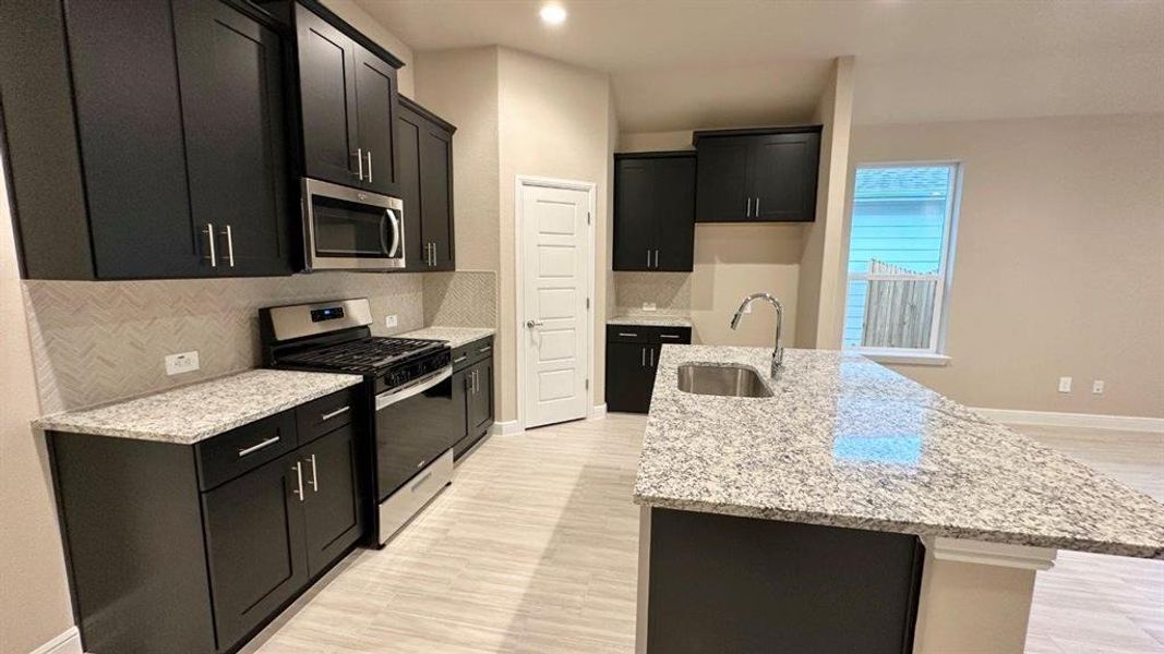 Kitchen - All Home and community information, including pricing, included features, terms, availability and amenities, are subject to change at any time without notice or obligation. All Drawings, pictures, photographs, video, square footages, floor plans, elevations, features, colors and sizes are approximate for illustration purposes only and will vary from the homes as built. Kitchen - All Home and community information, including pricing, included features, terms, availability and amenities, are subject to change at any time without notice or obligation. All Drawings, pictures, photographs, video, square footages, floor plans, elevations, features, colors and sizes are approximate for illustration purposes only and will vary from the homes as built.