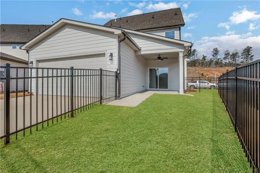 Exterior details and patio area of a home in Marble Tree, Ball Ground (Image 27).