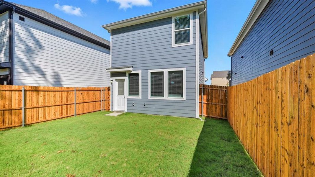Rear view of property featuring a fenced backyard Rear view of property featuring a fenced backyard