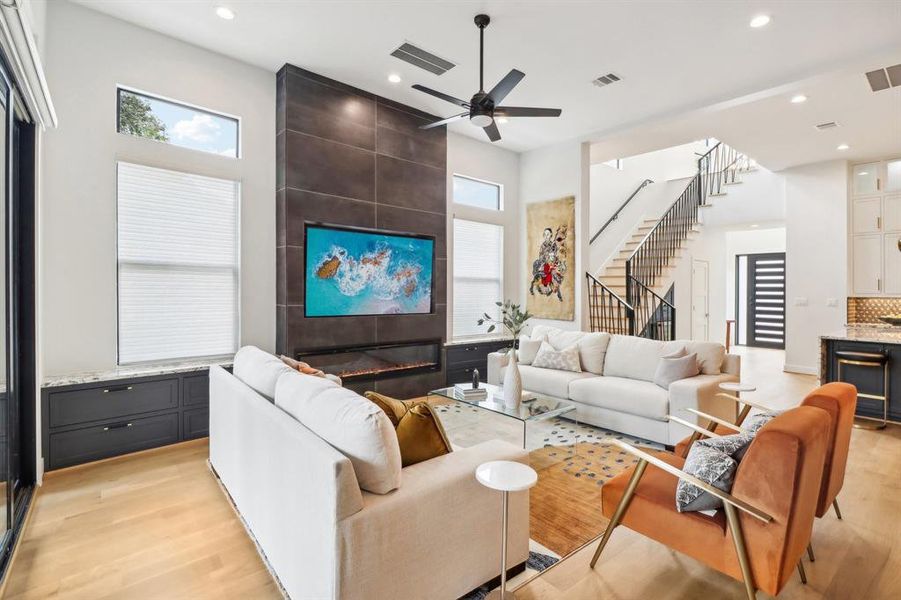 Looking toward the front of the home and the staircase, one's eye is drawn to a variety of colors and textures.