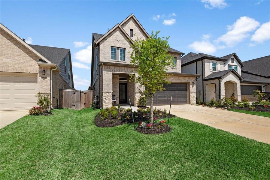 Front exterior of a new home in The Grand Prairie 40’, Hockley, TX, highlighting curb appeal (Image 23).