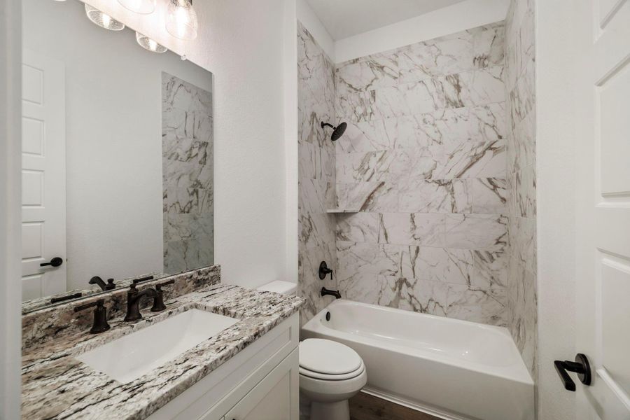 One of the full bathrooms located upstairs. One of the full bathrooms located upstairs.