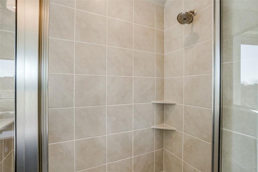 Bathroom featuring an enclosed shower Bathroom featuring an enclosed shower