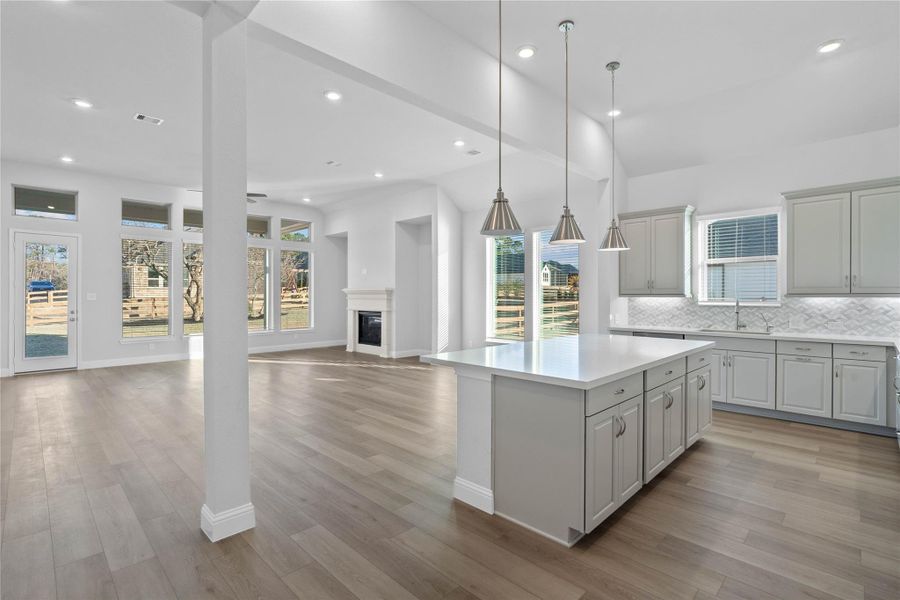 Bright, open-concept living designed for both everyday comfort and effortless entertaining. This expansive space features soaring ceilings, abundant natural light, and seamless flow between the kitchen and living area. Bright, open-concept living designed for both everyday comfort and effortless entertaining. This expansive space features soaring ceilings, abundant natural light, and seamless flow between the kitchen and living area.