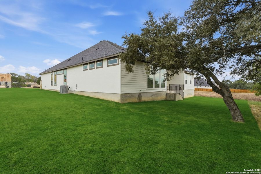Exterior details and patio area of a home in Potranco Oaks, Castroville (Image 28).