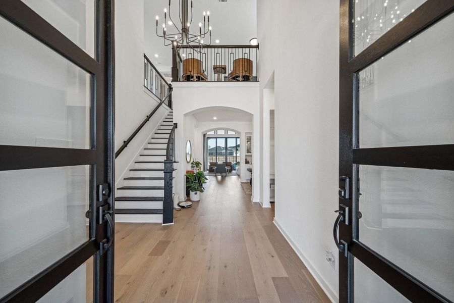 Enter the double front door to tall ceilings.