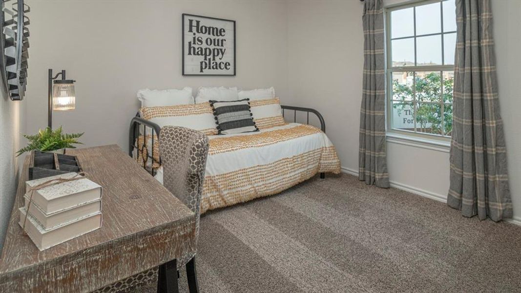 Textured gray carpet flooring, a window with grid panes, and crisp white baseboards