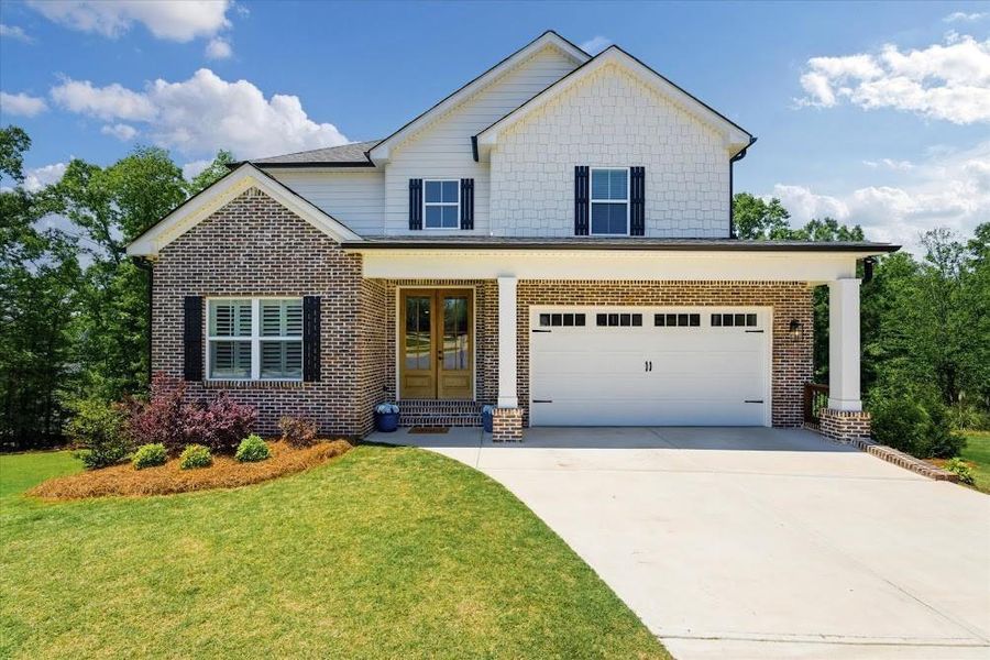 Front exterior of a new home in , Carrollton, GA, highlighting curb appeal (Image 21).